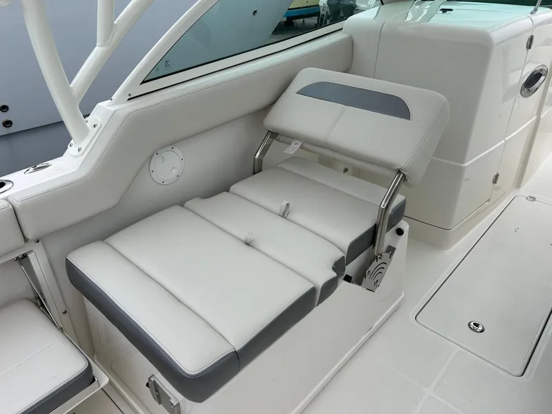 Slide: The Image of 2025 Sailfish 245 DC boat interior with adjustable seating. - 15