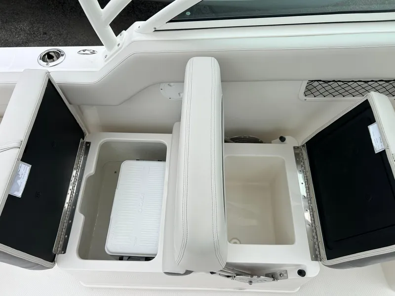 Slide: The Image of 2025 Sailfish 245 DC boat storage compartments and seating. - 17