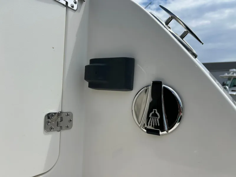 Slide: The Image of Close-up of 2025 Sailfish 245 DC boat shower control and hinge. - 32