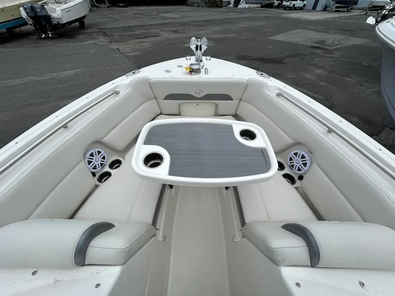 Slide: The Image of 2025 Sailfish 245 DC boat interior with seating and table. - 6