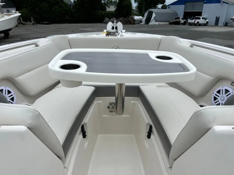 Slide: The Image of 2025 Sailfish 245 DC boat interior with seating and table. - 7