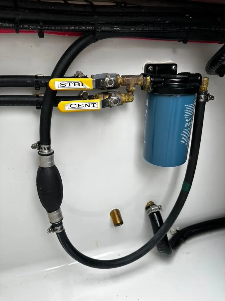 Slide: The Image of 2019 Contender 32 ST boat fuel system with filter and hoses. - 10