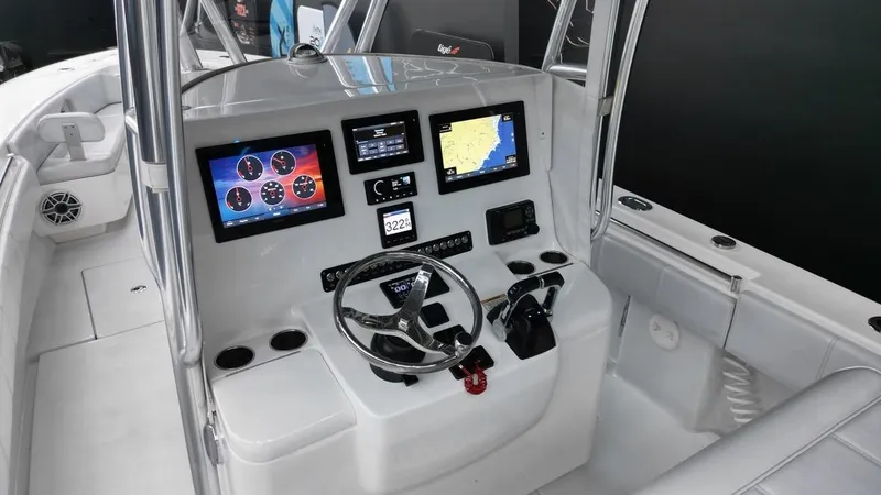 Slide: The Image of 2019 Contender 32 ST boat dashboard with modern navigation and control systems. - 2
