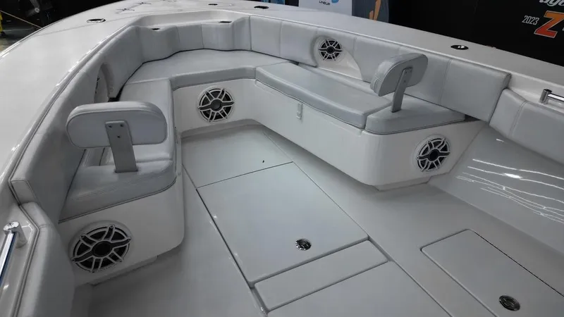 Slide: The Image of 2019 Contender 32 ST boat interior with cushioned seating and built-in speakers. - 4
