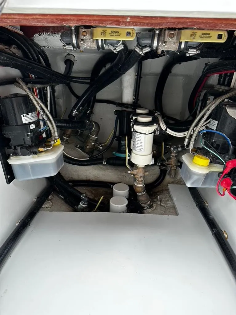 Slide: The Image of Engine compartment of a 2019 Contender 32 ST boat with various mechanical components. - 8