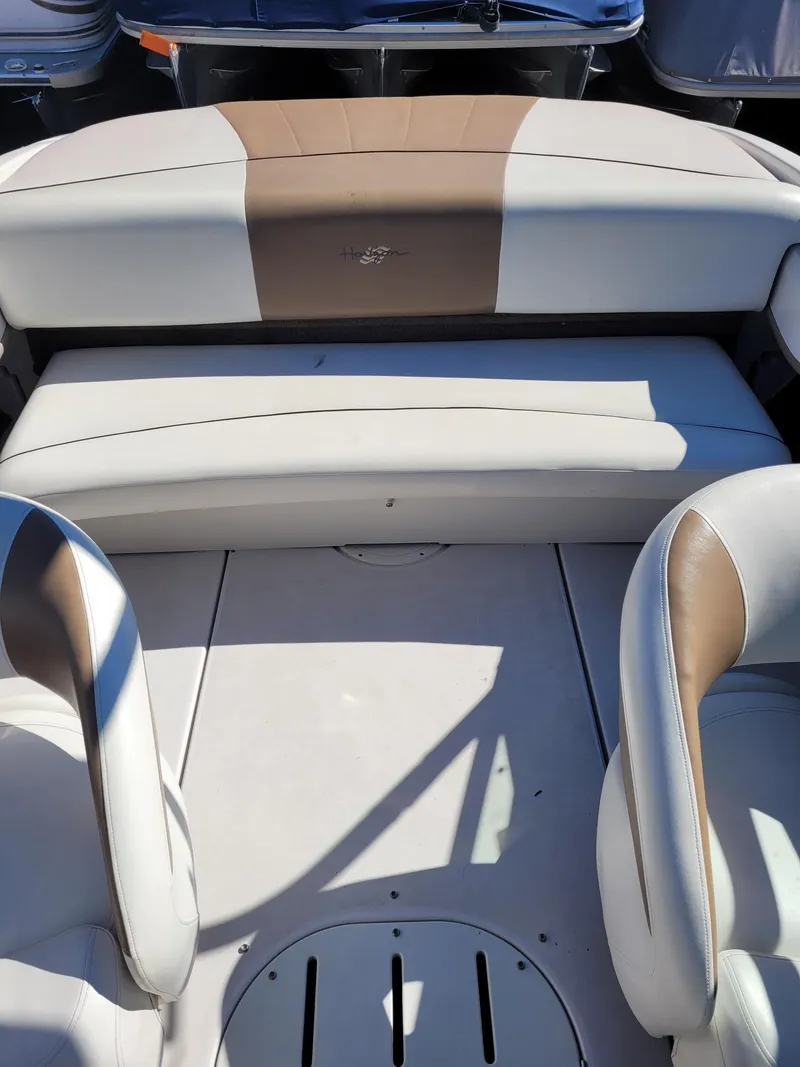 Slide: The Image of 2007 Four Winns 190 Horizon boat interior with beige and white seating. - 10