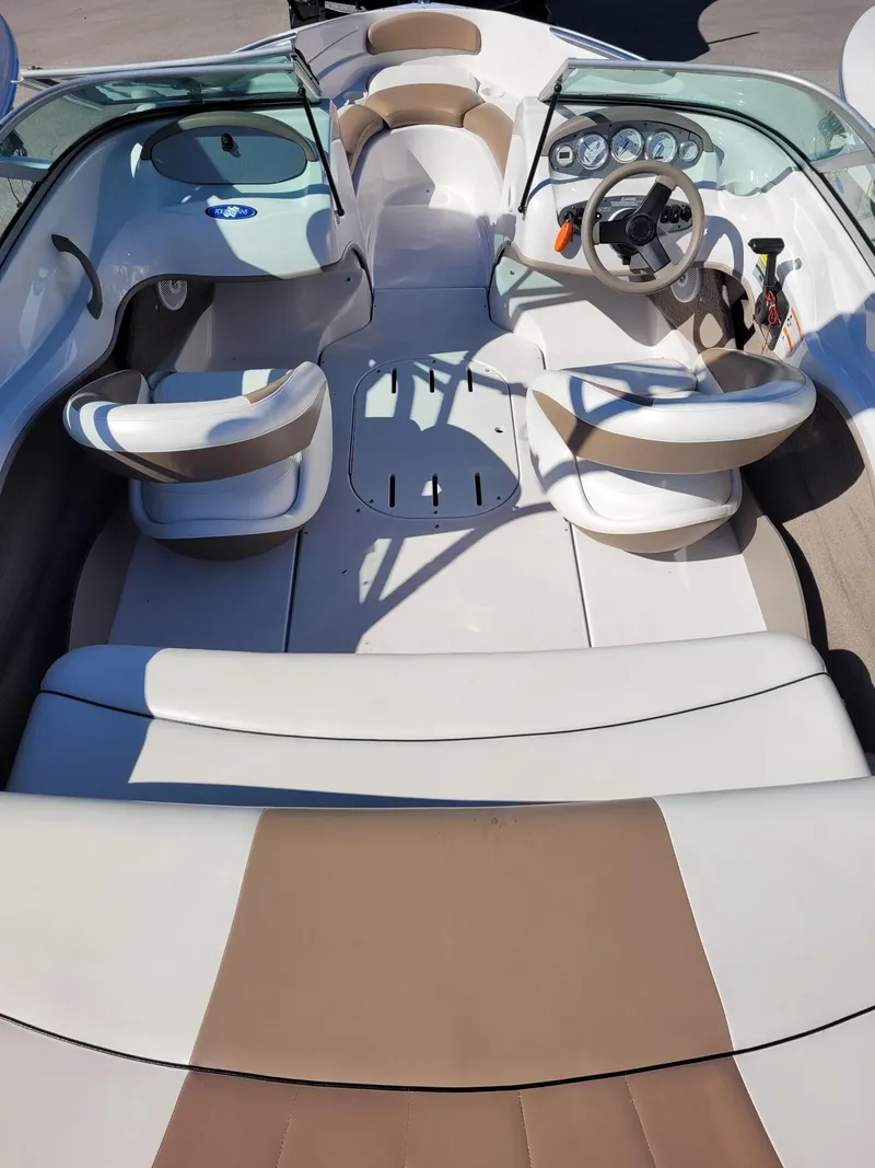 Slide: The Image of 2007 Four Winns 190 Horizon boat interior with beige and white seating. - 15