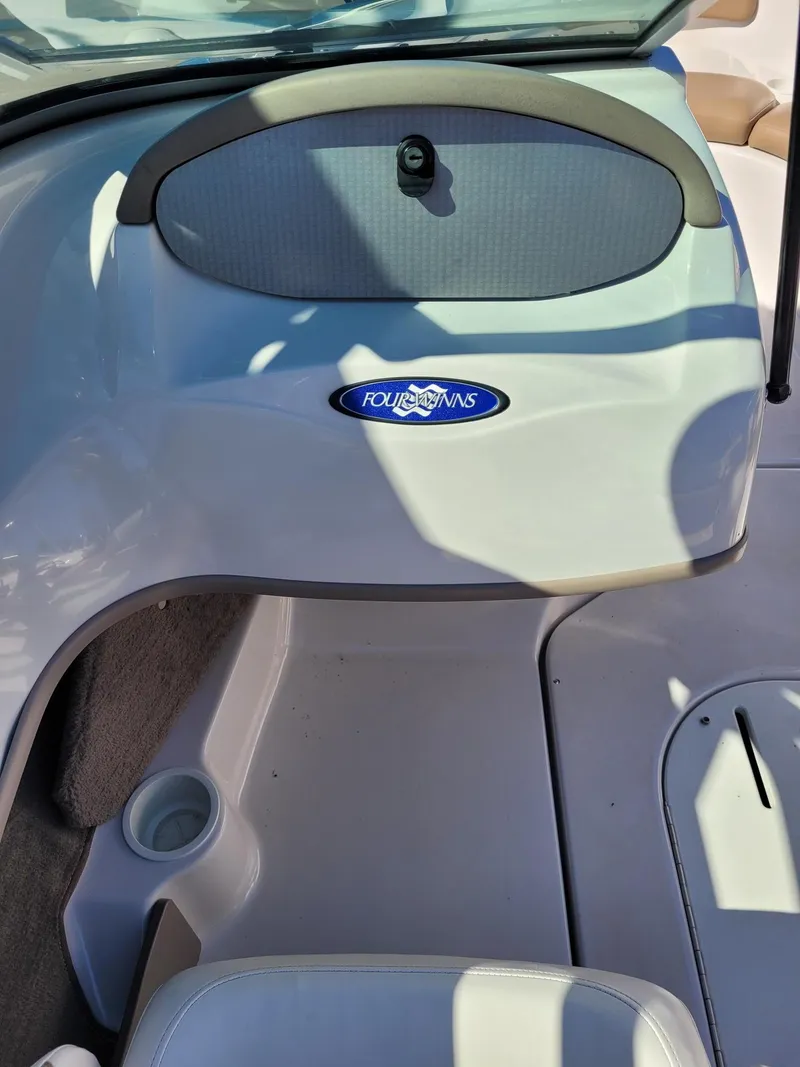 Slide: The Image of 2007 Four Winns 190 Horizon boat interior with logo and seating area. - 17