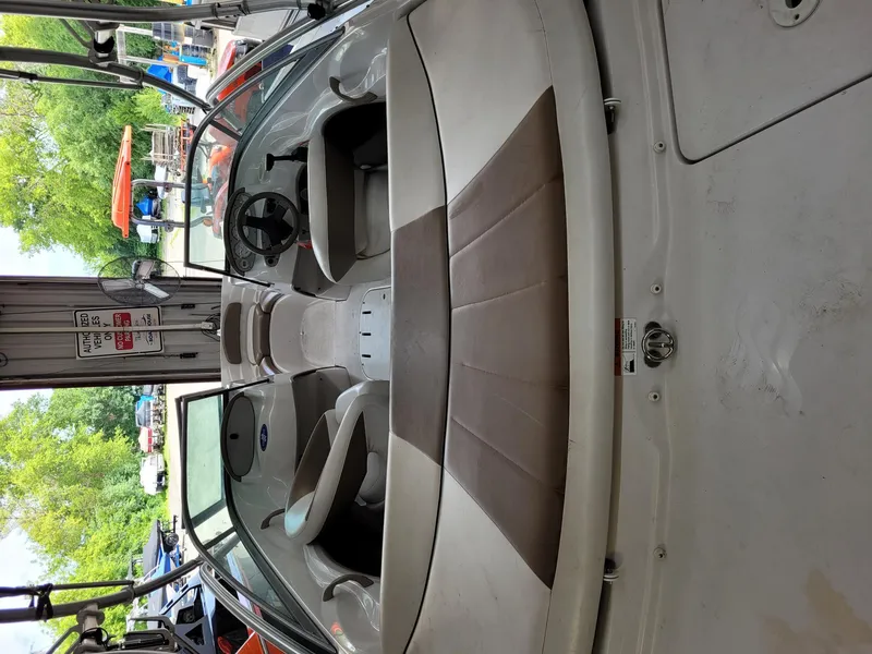 Slide: The Image of 2007 Four Winns 190 Horizon boat interior with seating and steering wheel. - 23