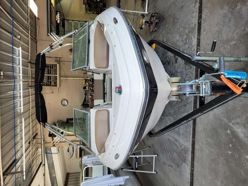 Slide: The Image of 2007 Four Winns 190 Horizon boat in a garage, front view. - 24
