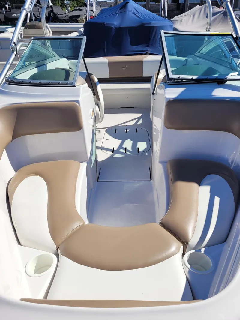 Slide: The Image of 2007 Four Winns 190 Horizon boat interior with tan and white seating. - 6
