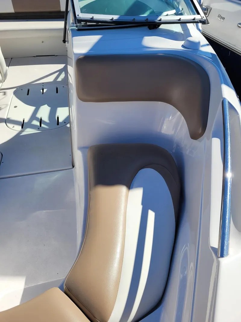Slide: The Image of 2007 Four Winns 190 Horizon boat interior with tan and white seating. - 8