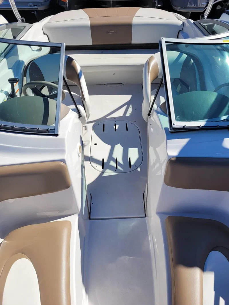 Slide: The Image of 2007 Four Winns 190 Horizon boat interior with tan and white seating. - 9