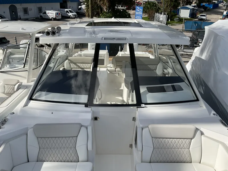 Slide: The Image of 2025 World Cat 400 DC-IS boat with sleek design and spacious seating. - 12