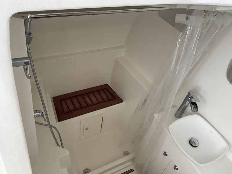 Slide: The Image of Interior of 2025 World Cat 400 DC-IS boat bathroom with shower and sink. - 21