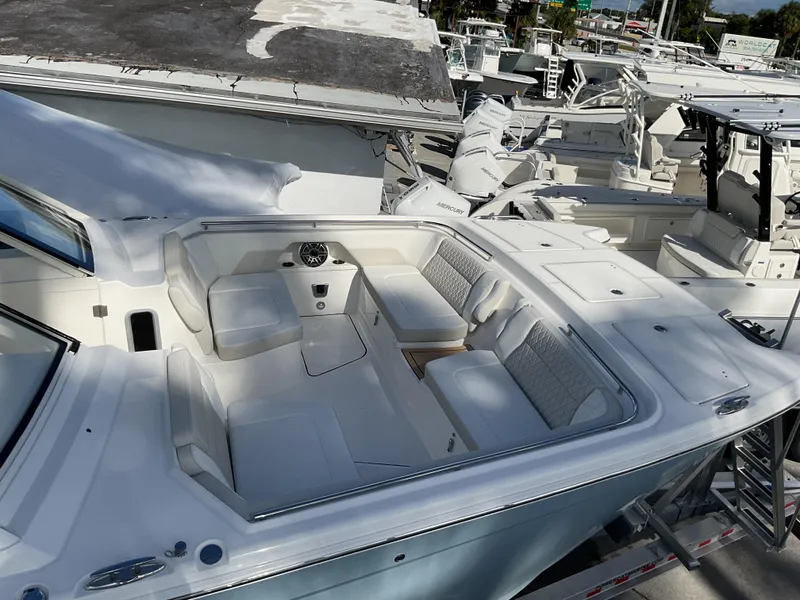 Slide: The Image of 2025 World Cat 400 DC-IS boat with spacious seating area in marina. - 27