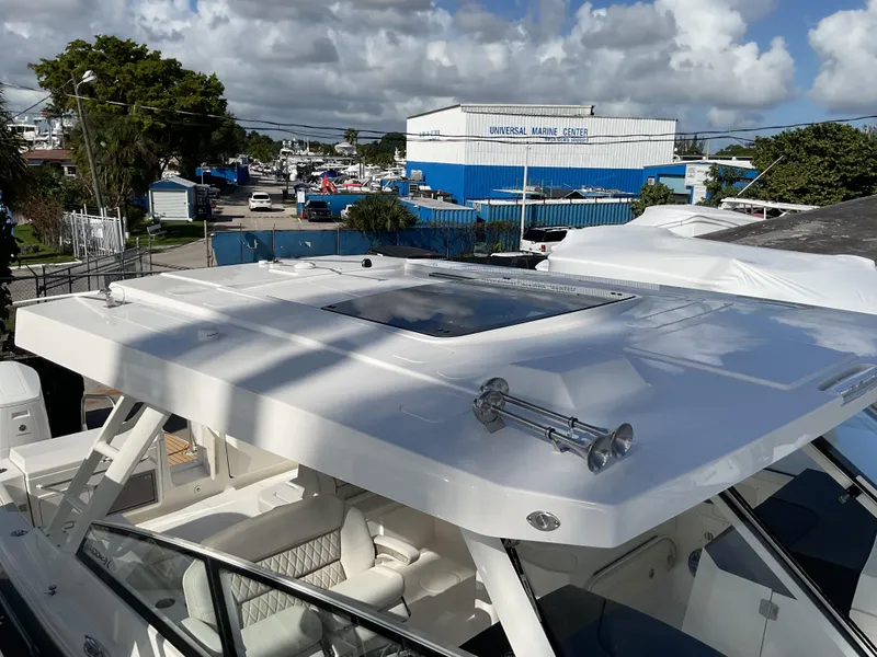 Slide: The Image of 2025 World Cat 400 DC-IS boat with sleek design and spacious deck. - 28