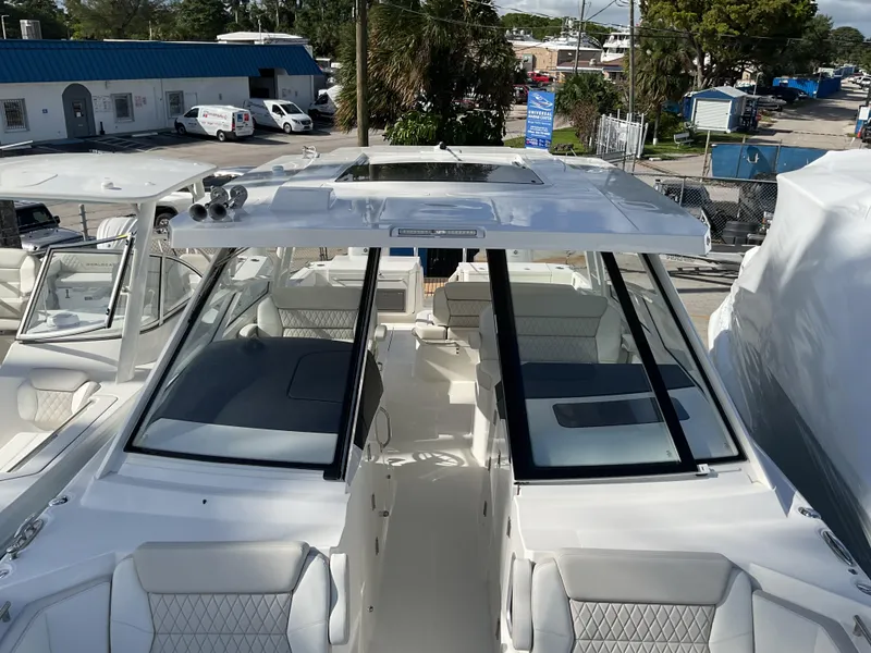 Slide: The Image of 2025 World Cat 400 DC-IS boat with sleek design and spacious seating. - 29