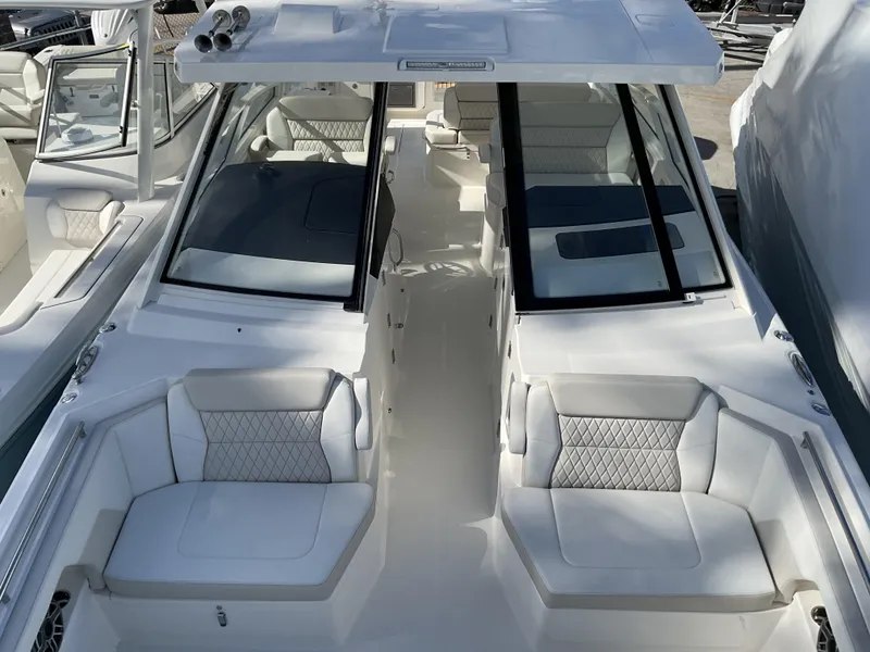 Slide: The Image of 2025 World Cat 400 DC-IS boat with luxurious seating and sleek design. - 30