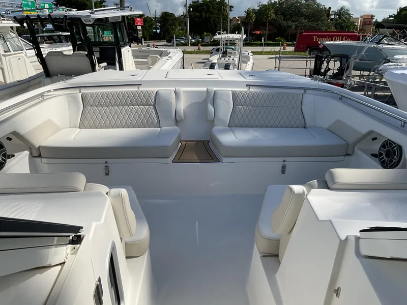 Slide: The Image of Luxurious seating area on 2025 World Cat 400 DC-IS boat, featuring elegant white upholstery. - 31