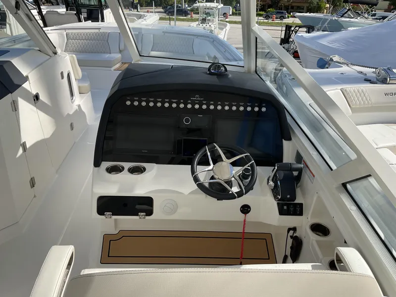 Slide: The Image of 2025 World Cat 400 DC-IS boat cockpit with modern steering and control panel. - 32