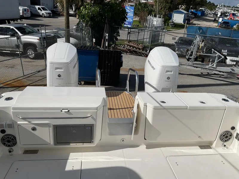 Slide: The Image of 2025 World Cat 400 DC-IS boat deck with twin outboard engines. - 36