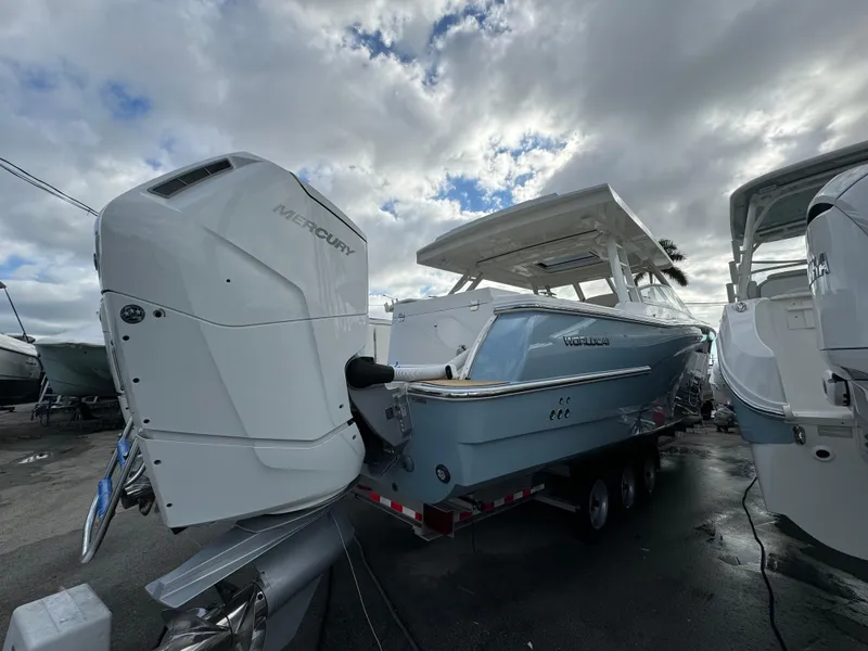 Slide: The Image of Interior of 2025 World Cat 400 DC-IS boat bathroom with shower and sink. - 10