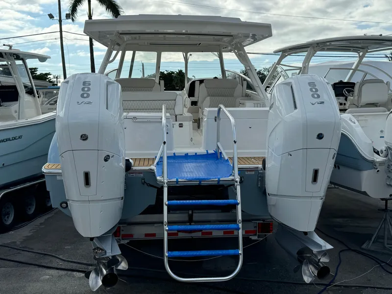 Slide: The Image of 2025 World Cat 400 DC-IS boat with sleek design and spacious deck. - 11