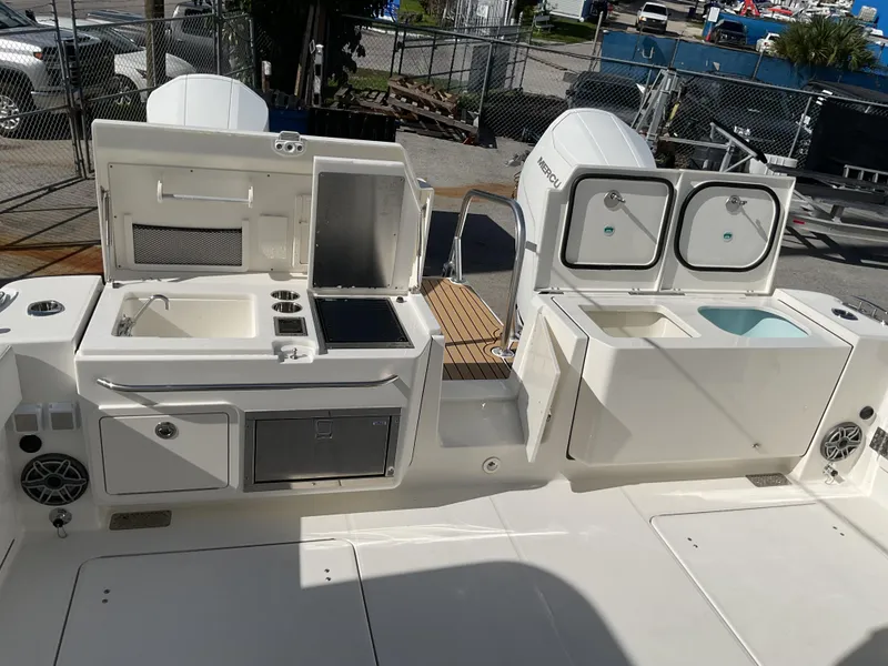 Slide: The Image of Luxurious seating area on 2025 World Cat 400 DC-IS boat, featuring elegant white upholstery. - 14