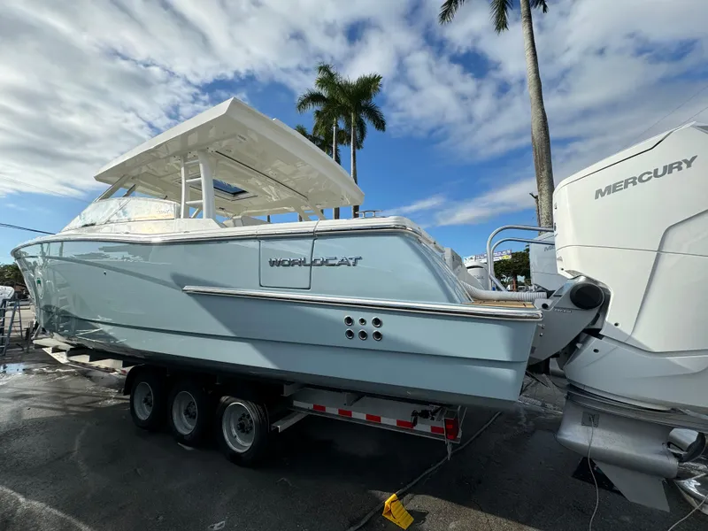 Slide: The Image of Storage compartment with blue fenders and rope on a 2025 World Cat 400 DC-IS boat. - 5