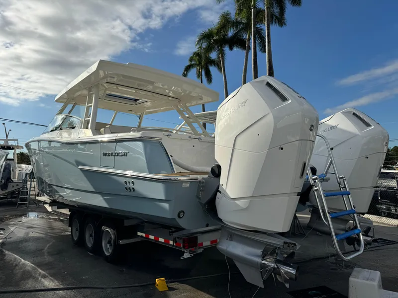 Slide: The Image of Interior of 2025 World Cat 400 DC-IS boat with control panel and seating. - 7