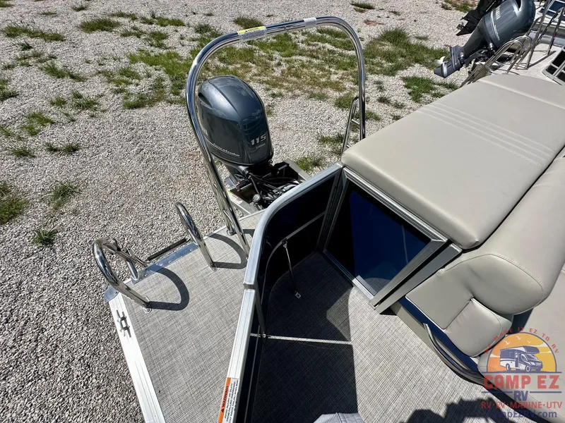 Slide: The Image of 2025 South Bay 220CR LE pontoon boat with outboard motor and swim ladder. - 12