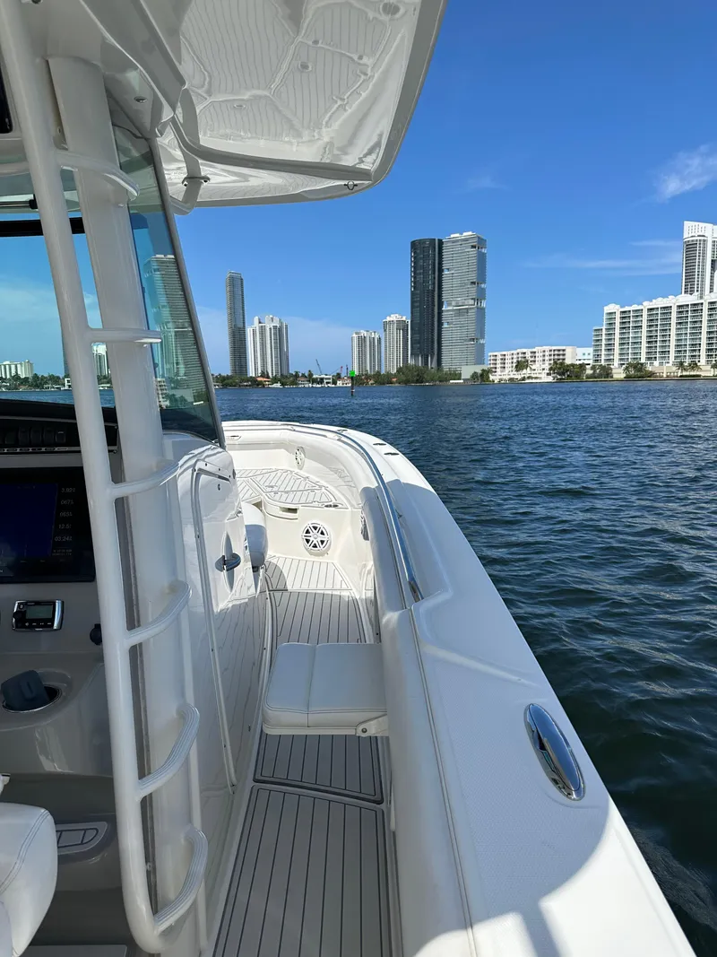 Slide: The Image of 2016 Boston Whaler 350 Outrage on water with city skyline in background. - 31
