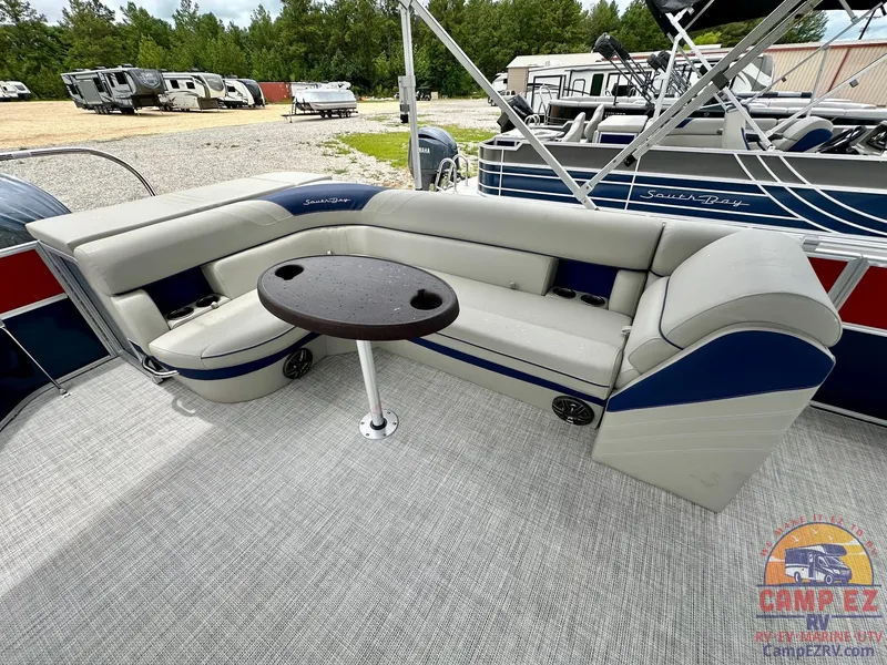 Slide: The Image of 2025 South Bay 224CR LE pontoon boat with spacious seating and table. - 16