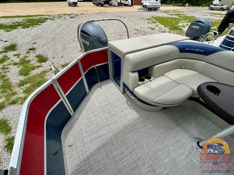 Slide: The Image of 2025 South Bay 224CR LE pontoon boat with Yamaha outboard motor, spacious seating, and carpeted deck. - 17
