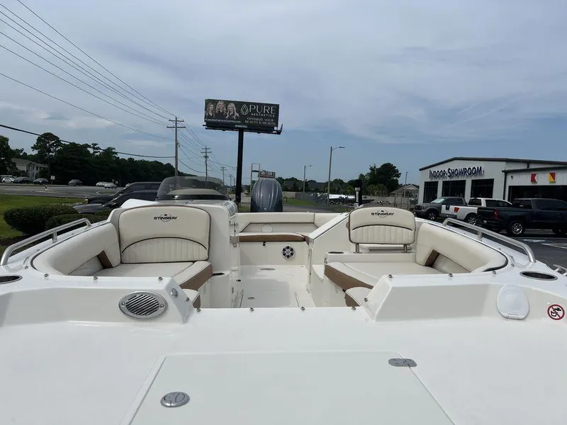 Slide: The Image of 2024 Stingray 212SC boat interior with seating and storage compartments. - 5