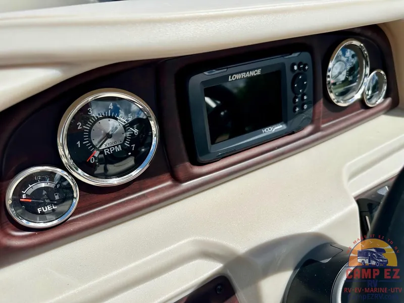 Slide: The Image of Dashboard of 2025 South Bay 220CR LE with Lowrance display and gauges. - 20