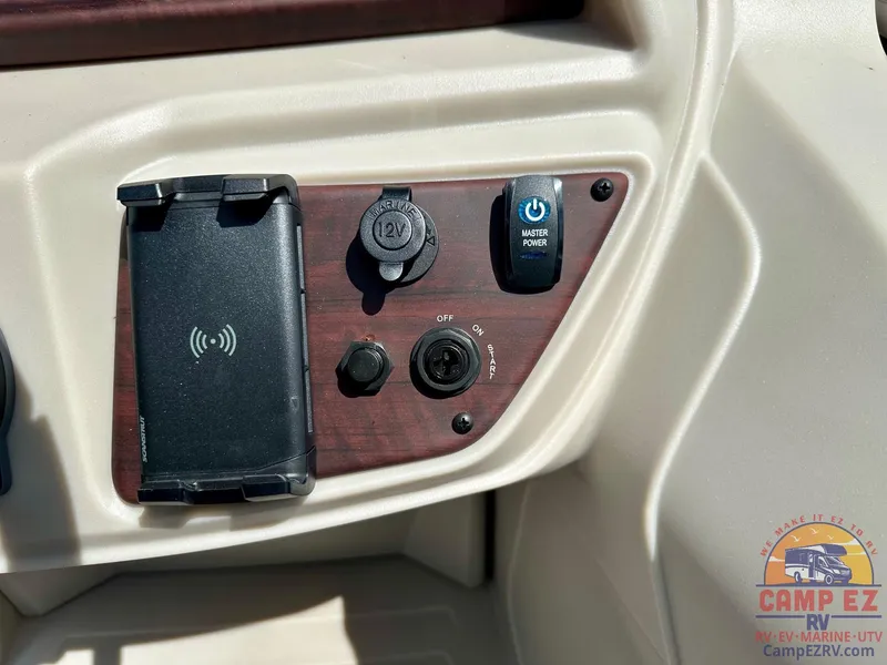 Slide: The Image of Control panel of 2025 South Bay 220CR LE pontoon boat with power and charging ports. - 21