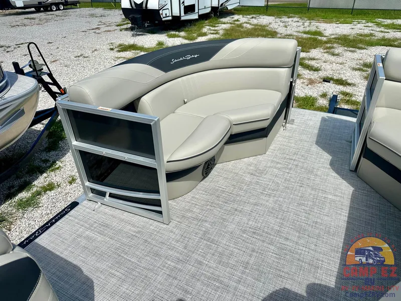 Slide: The Image of 2025 South Bay 220CR LE pontoon boat with beige seating and modern design. - 24