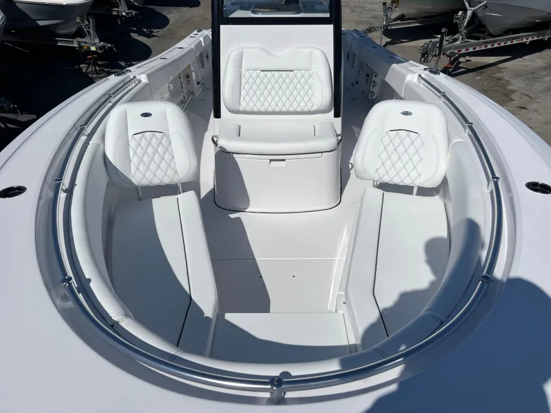 Slide: The Image of 2025 Sportsman Open 282 Center Console boat with white seating and sleek design. - 13