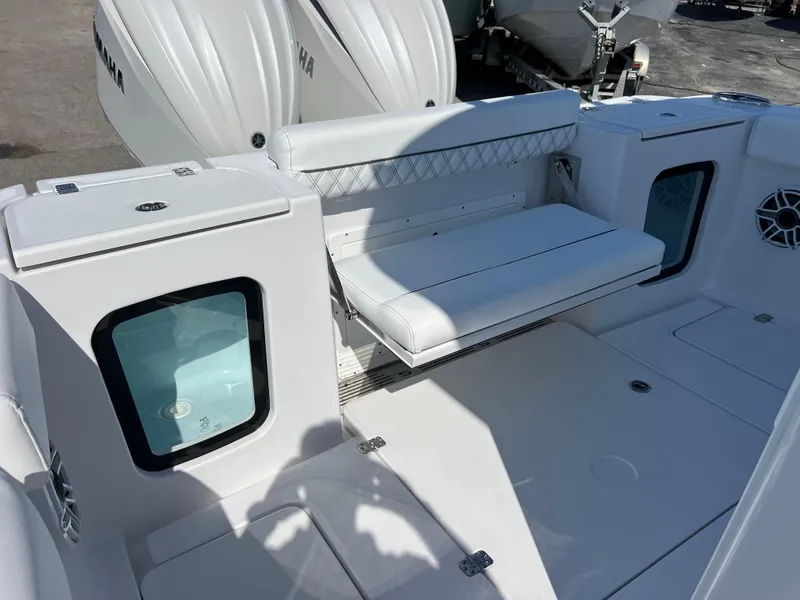 Slide: The Image of 2025 Sportsman Open 282 Center Console boat interior with seating and storage compartments. - 18