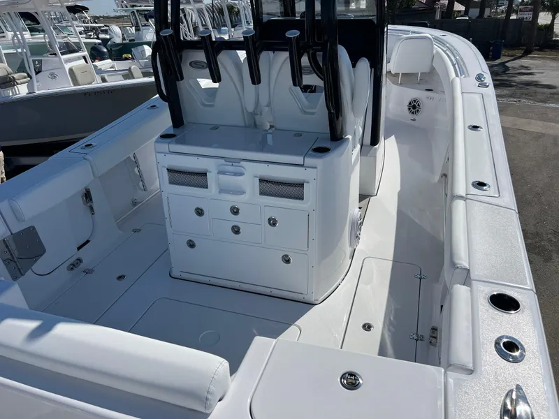 Slide: The Image of 2025 Sportsman Open 282 Center Console boat interior with seating and storage compartments. - 6
