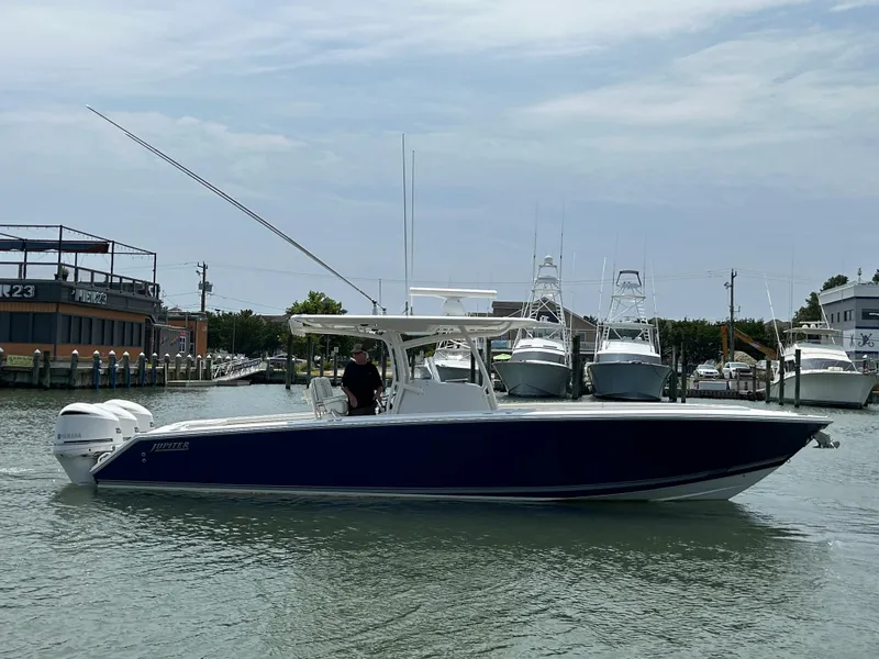 Slide: The Image of 2016 Jupiter 34 HFS boat with Triple Yamaha F300 engines on water. - 10