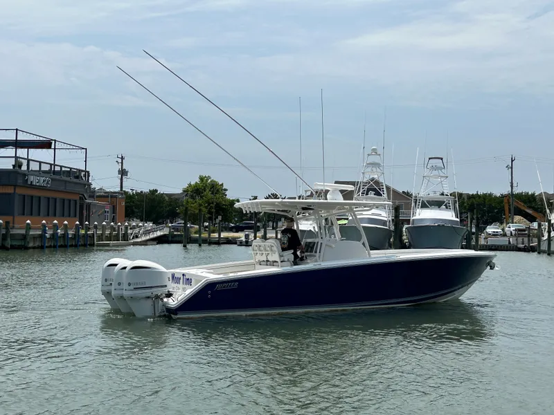 Slide: The Image of 2016 Jupiter 34 HFS boat with Triple Yamaha F300 engines on the water. - 17