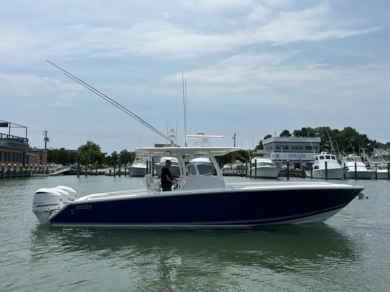 Slide: The Image of 2016 Jupiter 34 HFS boat with Triple Yamaha F300 engines on the water. - 19