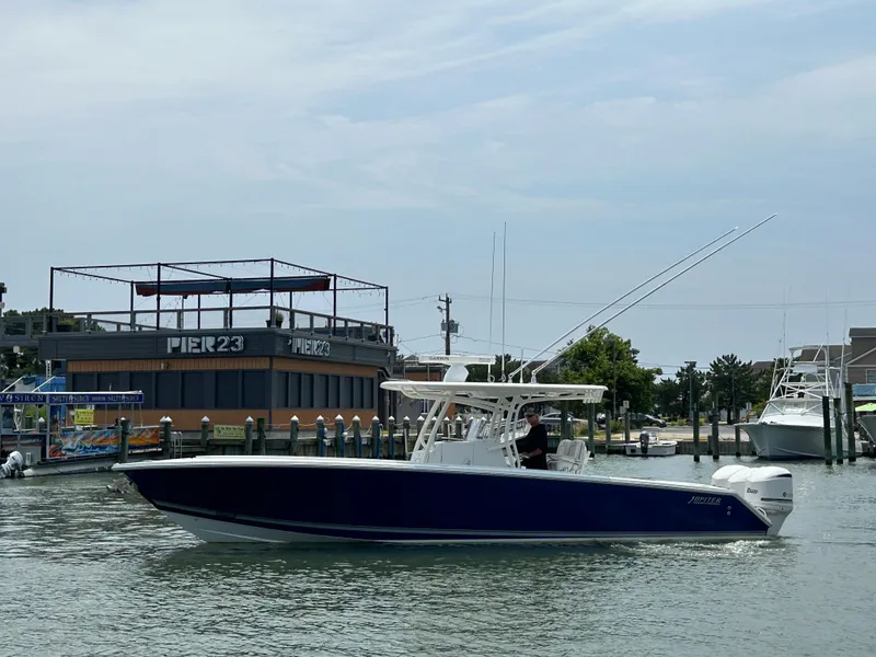 Slide: The Image of 2016 Jupiter 34 HFS boat with Triple Yamaha F300s at Pier 23 marina. - 2