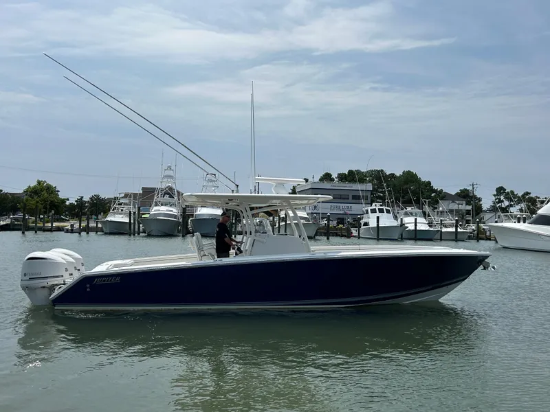 Slide: The Image of 2016 Jupiter 34 HFS boat with Triple Yamaha F300 engines on the water. - 20