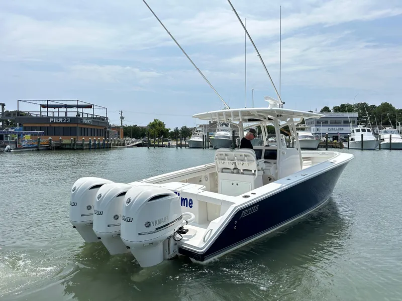 Slide: The Image of 2016 Jupiter 34 HFS boat with triple Yamaha F300 engines on the water. - 23