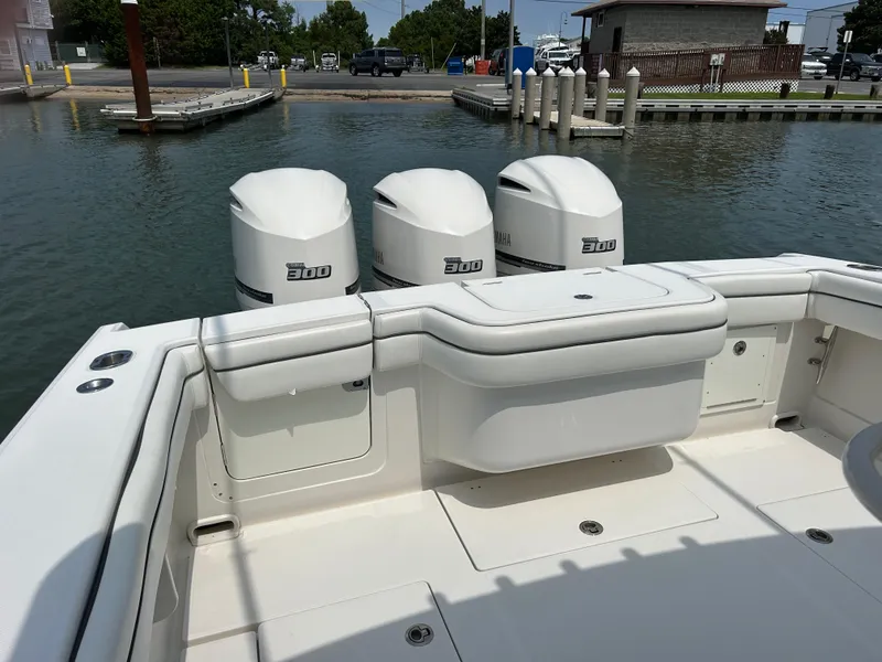 Slide: The Image of 2016 Jupiter 34 HFS boat with triple Yamaha F300 engines at dock. - 29