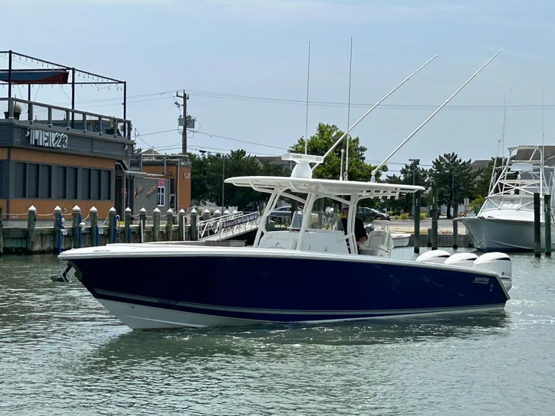 Slide: The Image of 2016 Jupiter 34 HFS boat with Triple Yamaha F300 engines on the water. - 4